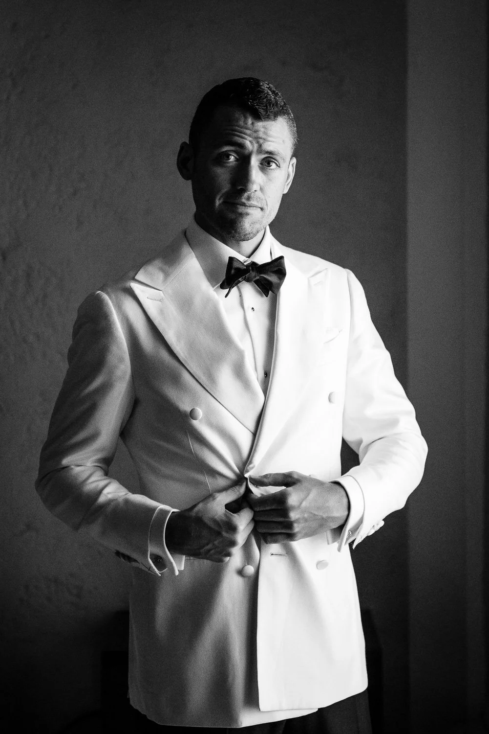 Groom Poses for Photo before his wedding ceremony at the Crane Beach Hotel in Barbados. Photo by Aniya Emtage
