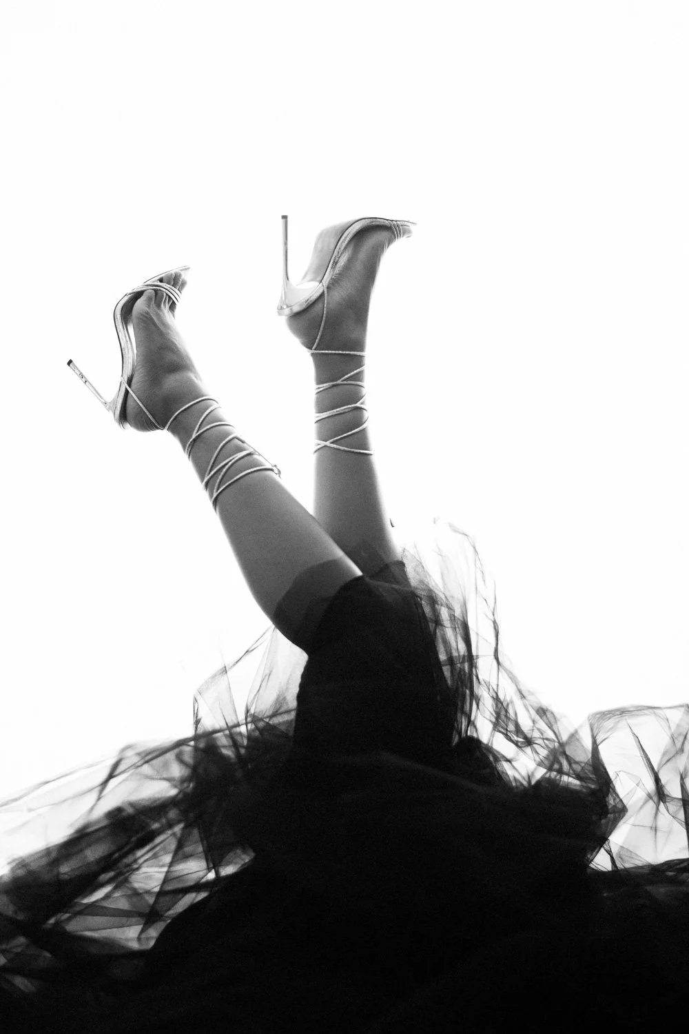 photo of a womans shoes during a boudoir session in Barbados. Photo by Aniya Emtage