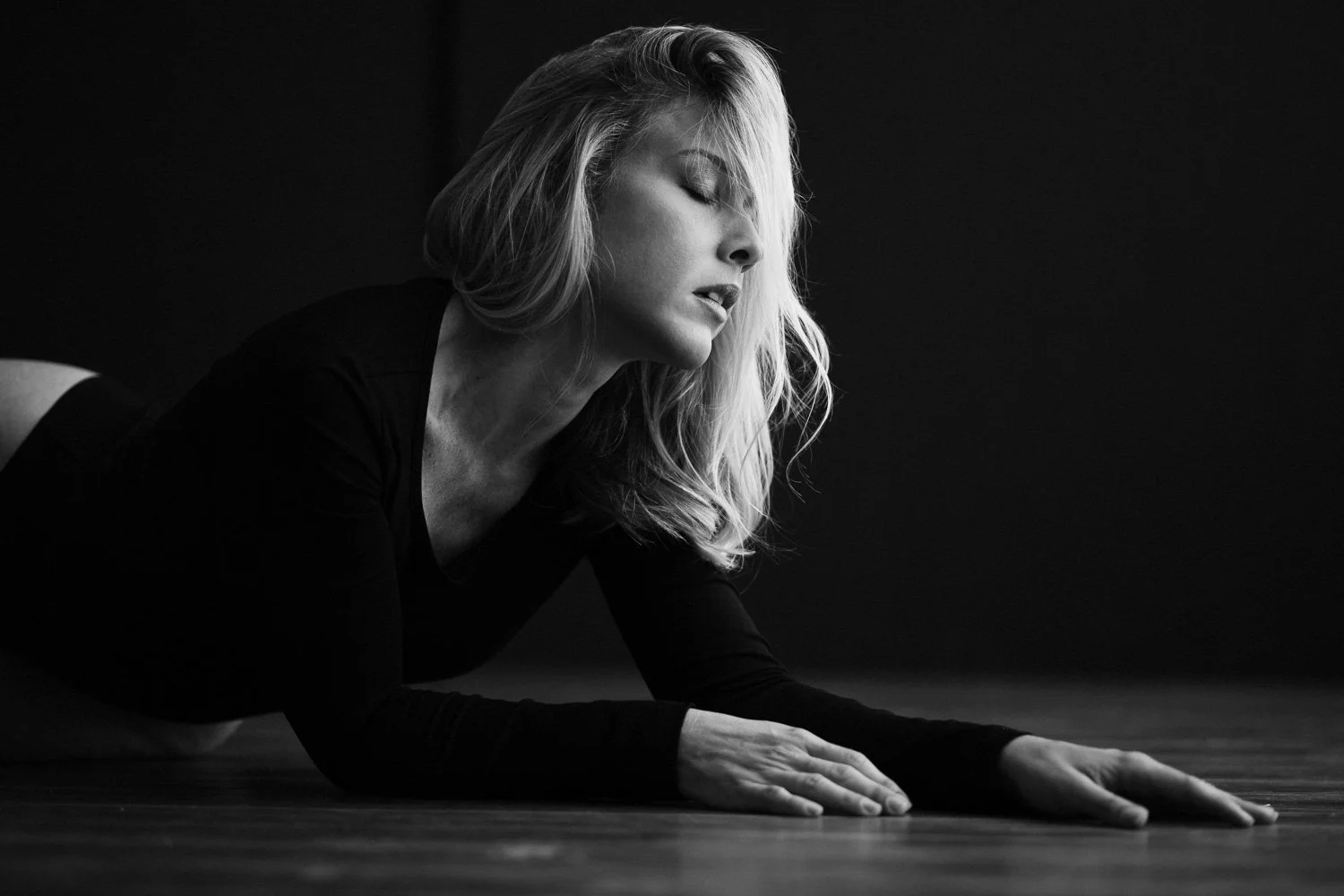 black and white photo of a woman taken during a boudoir session photographed by Aniya Emtage in Barbados