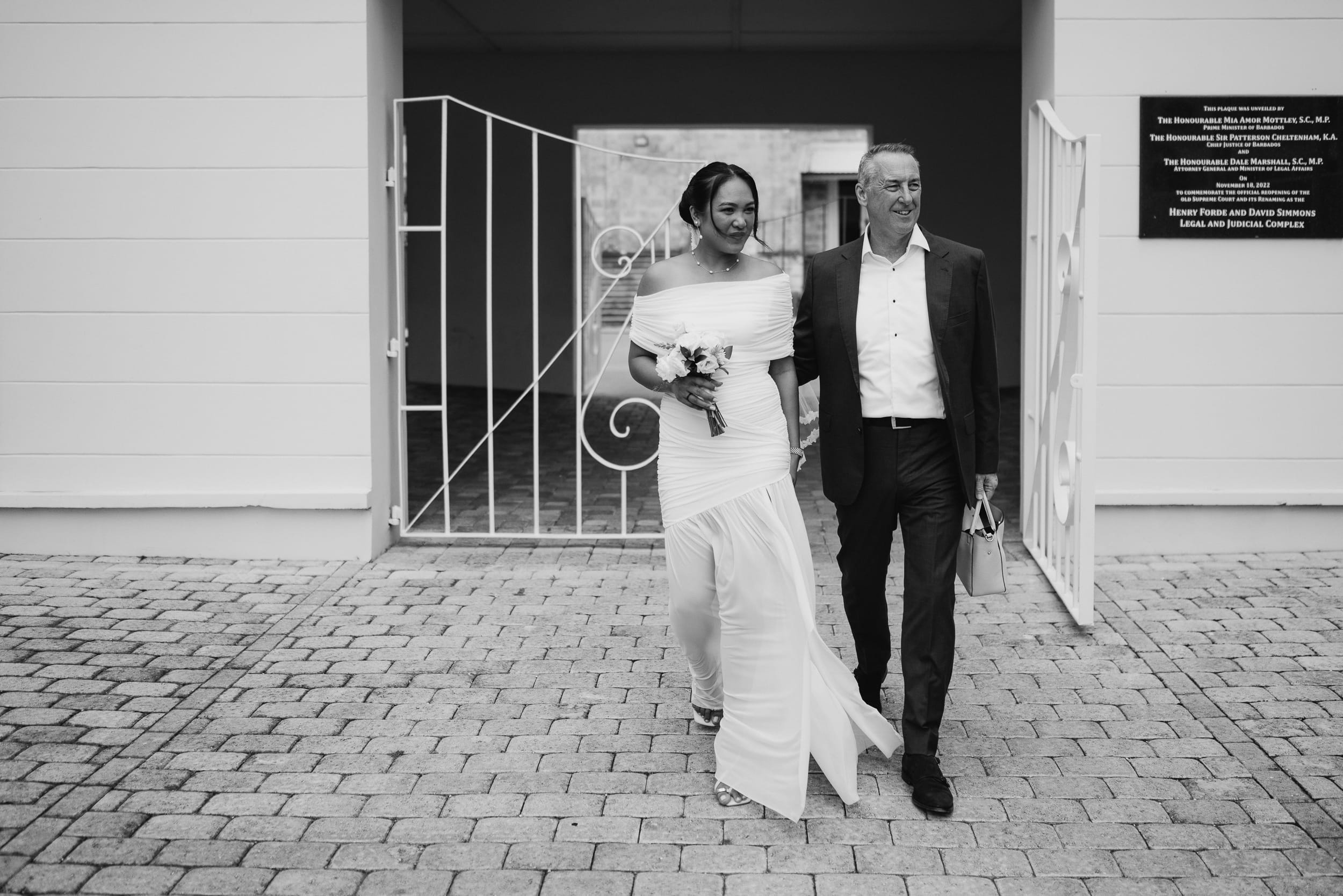 couple walking together after their barbados courthouse ceremony