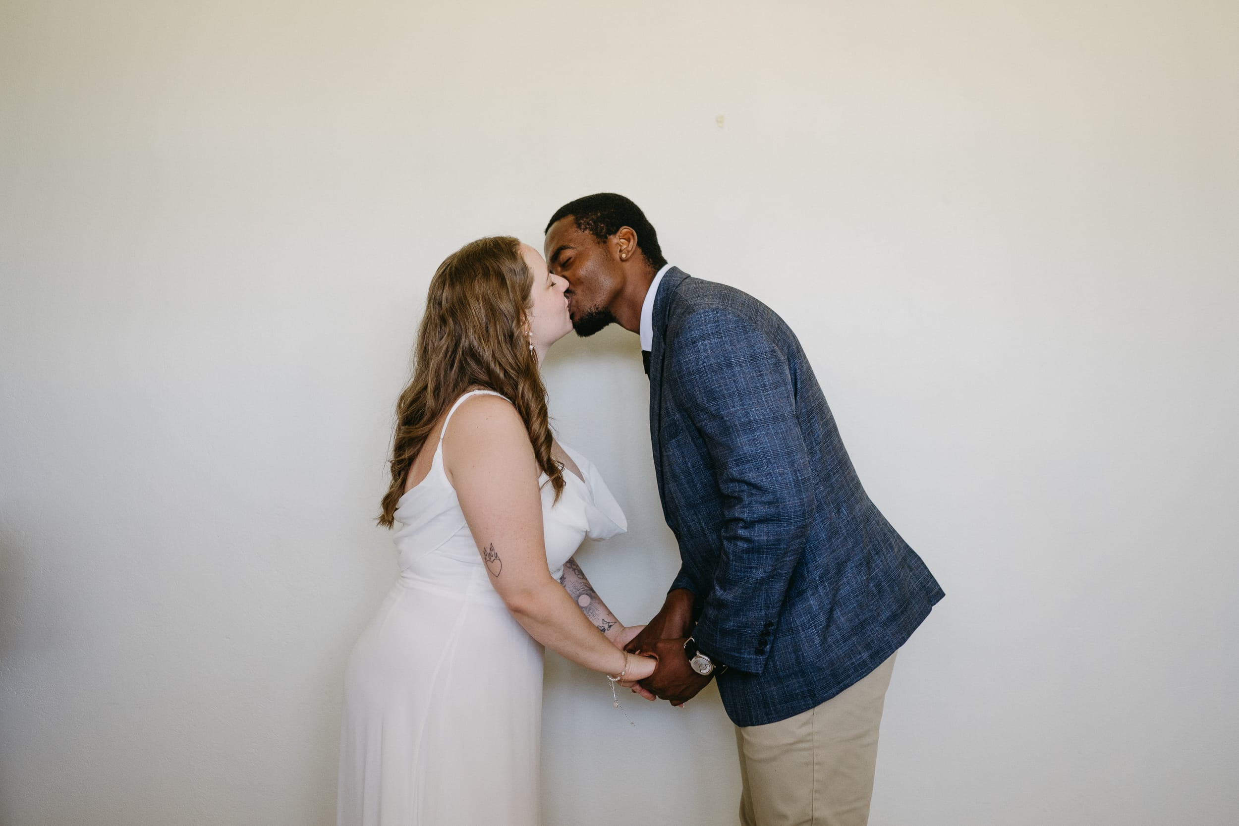 couple share their first kiss after their oistins Barbados courthouse wedding