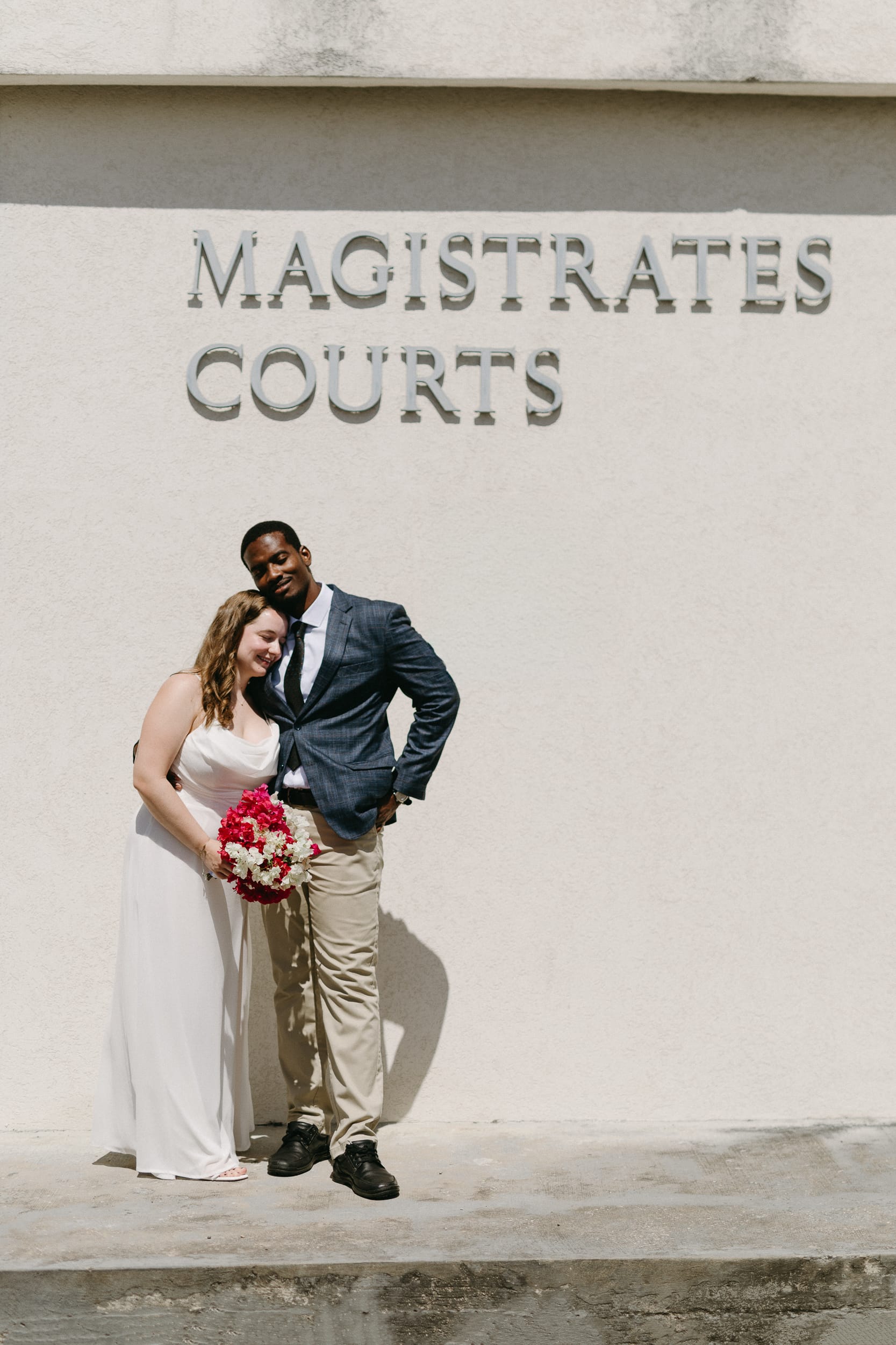Happy couple embracing after their Barbados Courthouse Wedding