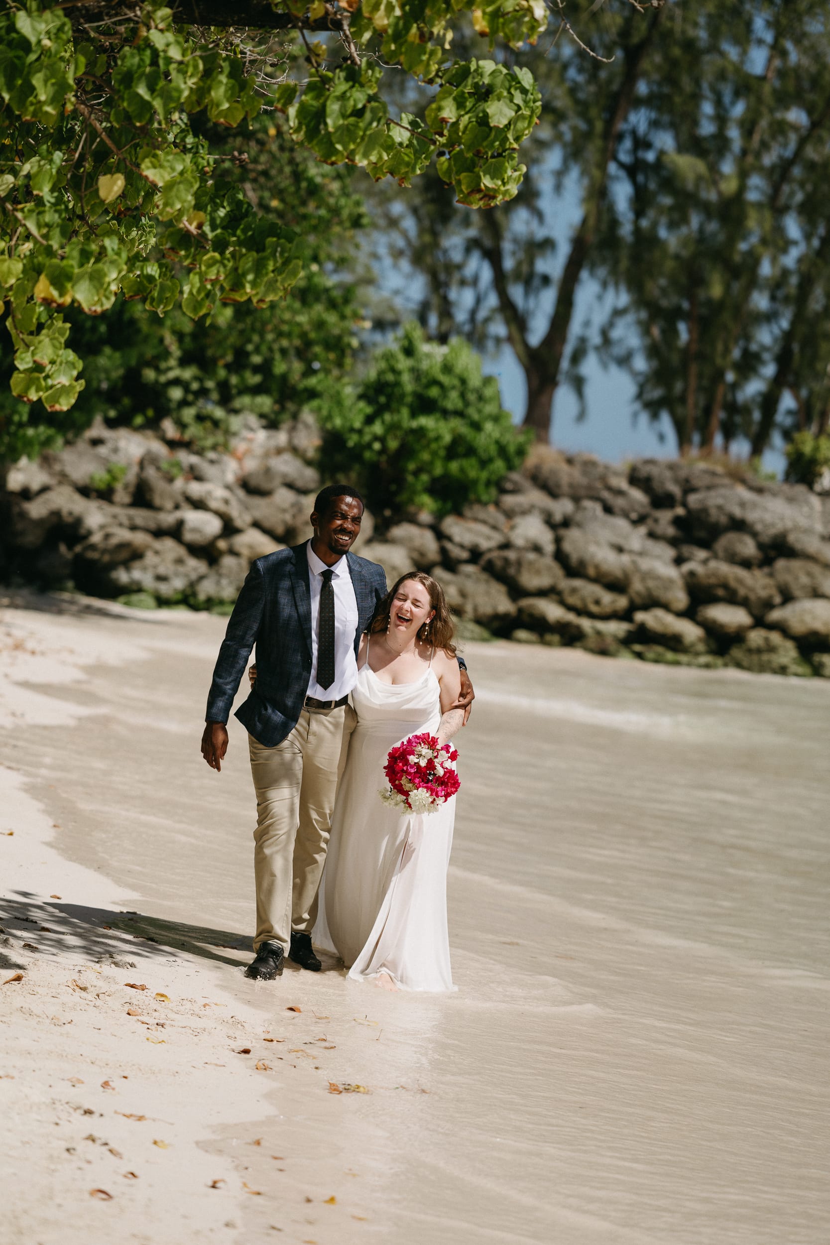 couple walking on the beach after their Barbados courthouse wedding