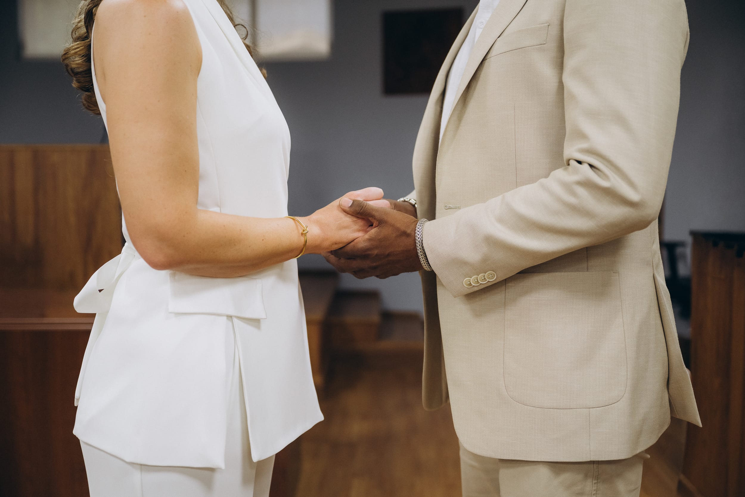 couple holding hands at their barbados courthouse wedding