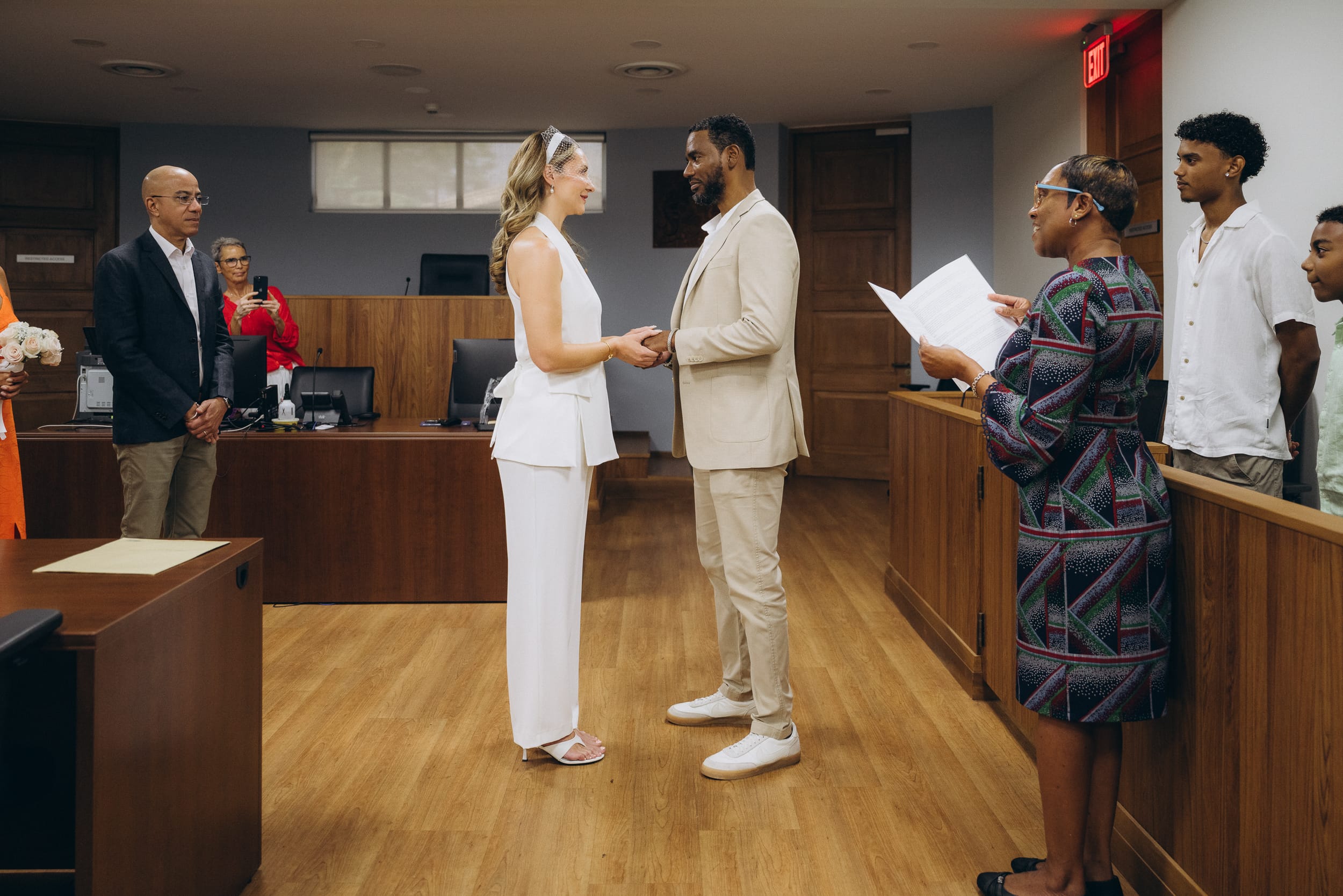 Couple exchanging vows at their Barbados Courthouse Wedding