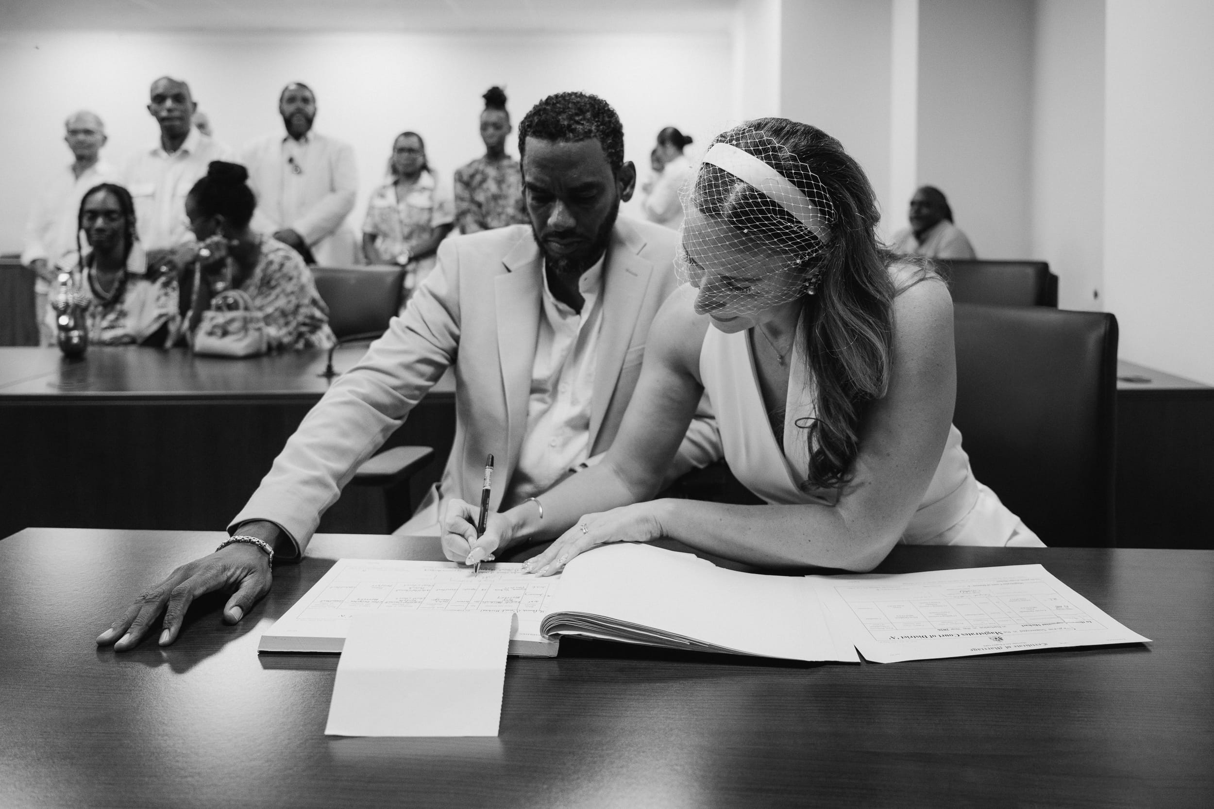 signing the wedding documents at the barbados courthouse wedding