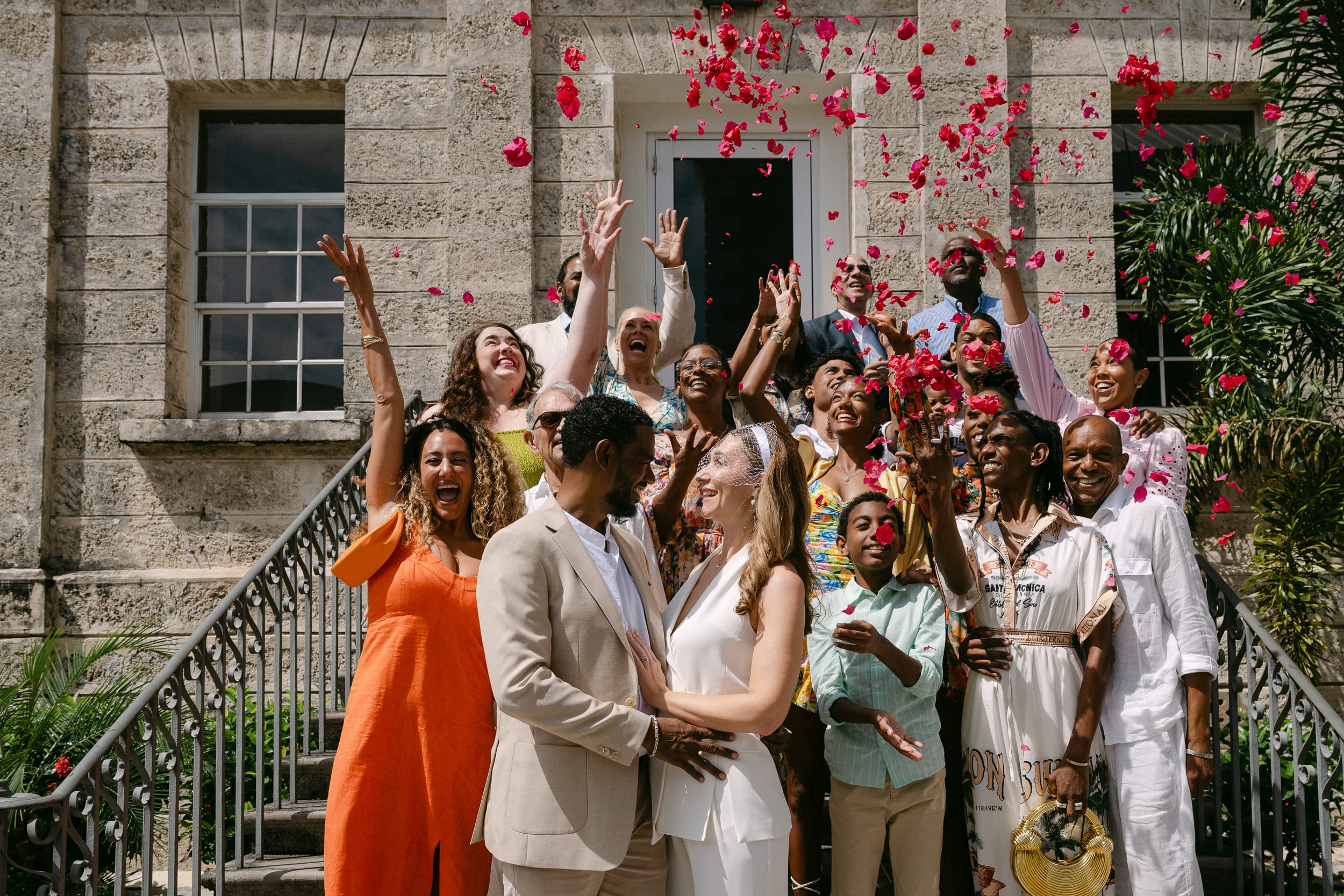 confetti toss on the stairs after their Barbados Courthouse Wedding