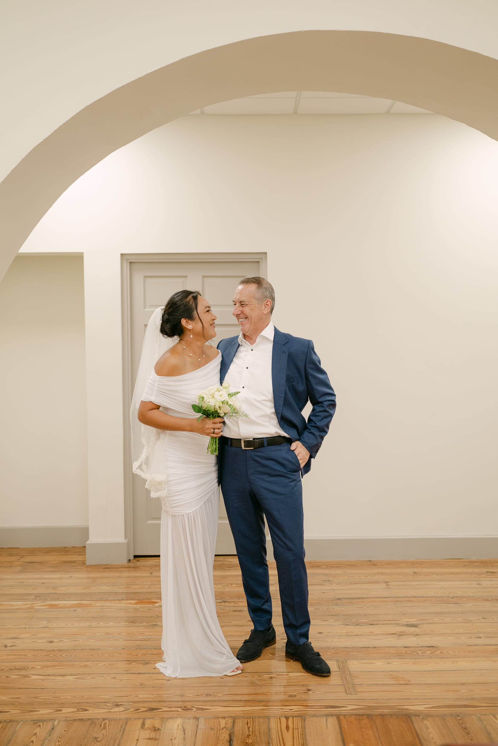 couple laugh together after their barbados courthouse wedding