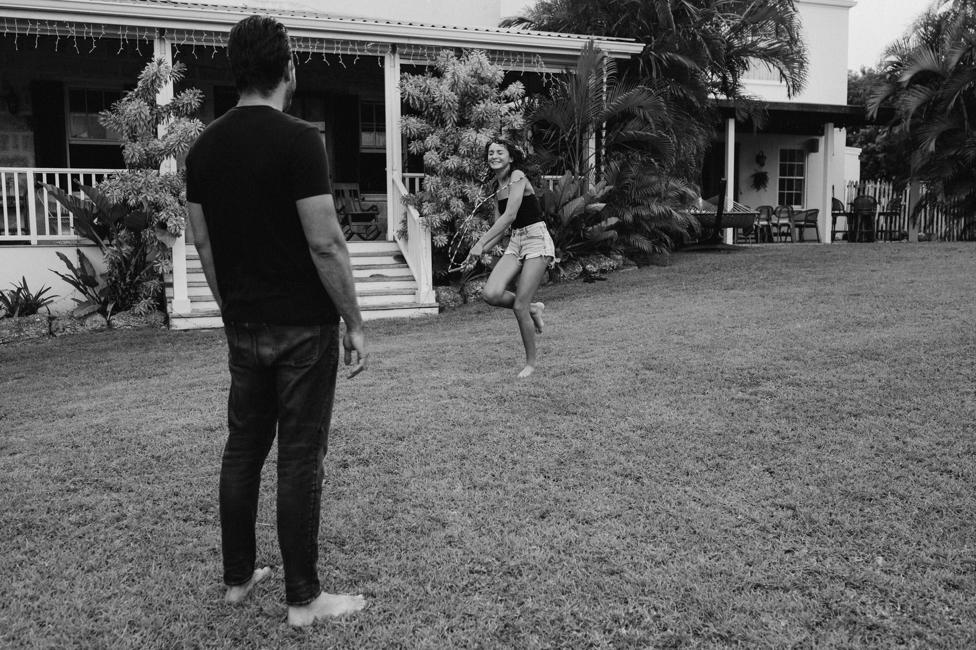 dad watching daughter learning how to skip