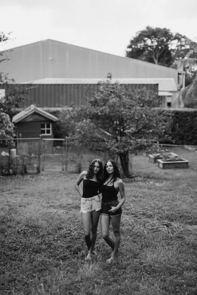 mom and daughter standing together