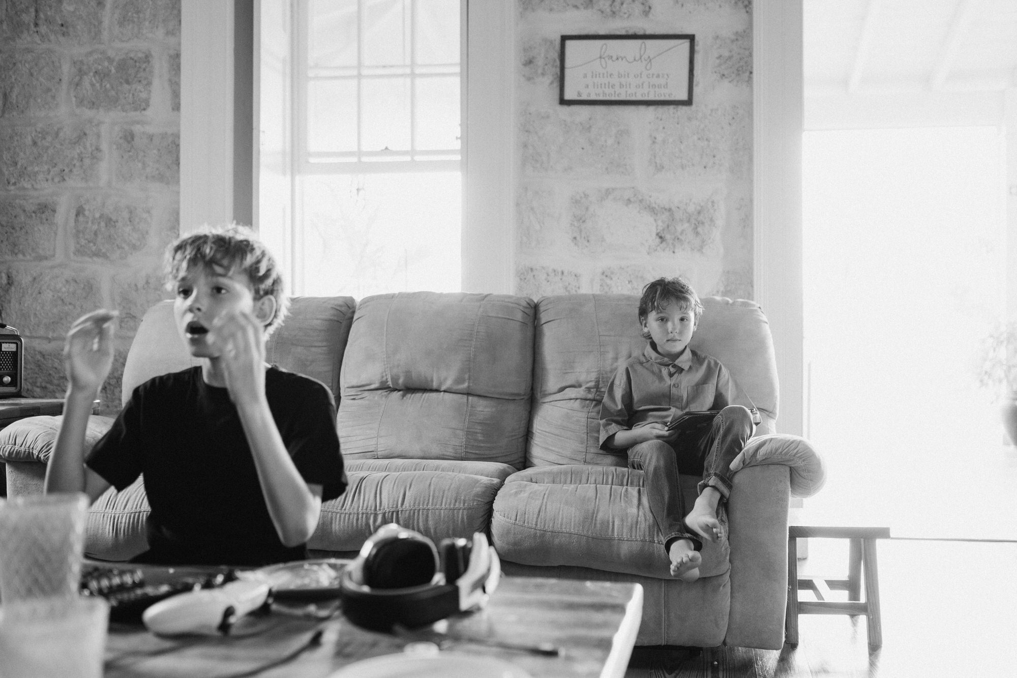 brothers intently playing video games