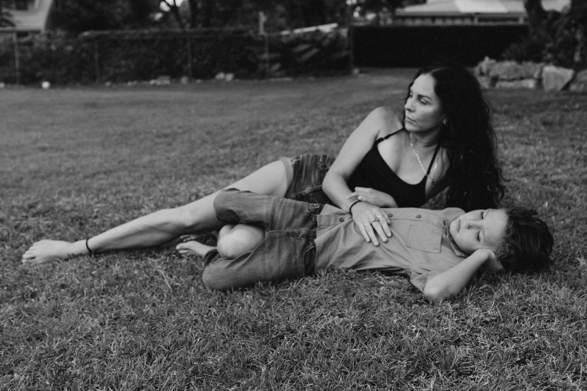 mom and son lying down together