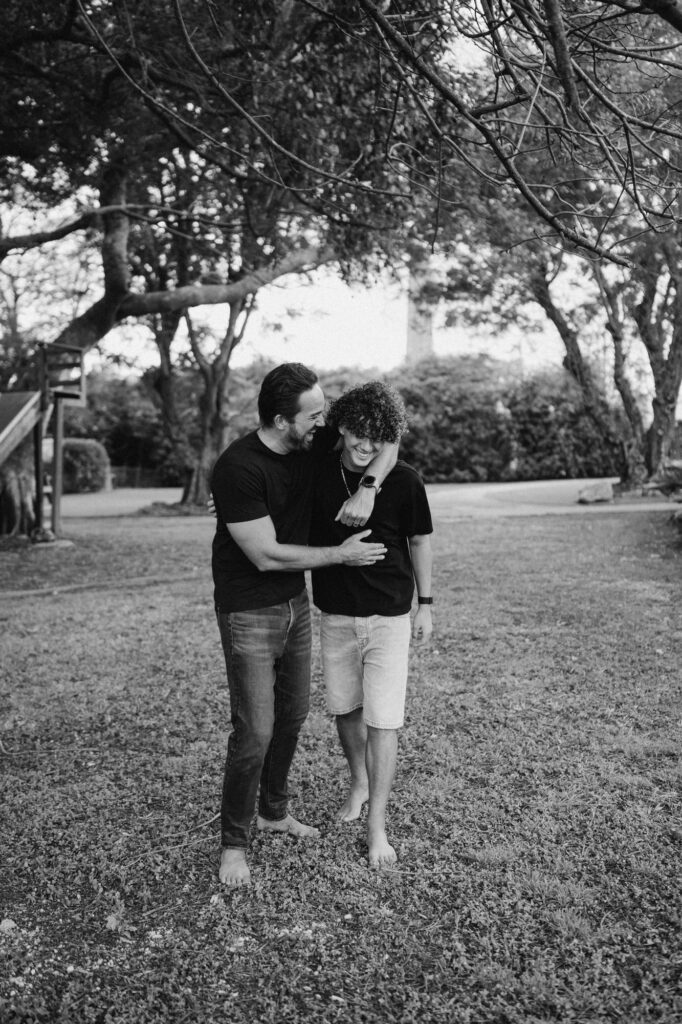 dad and sun hugging and laughing