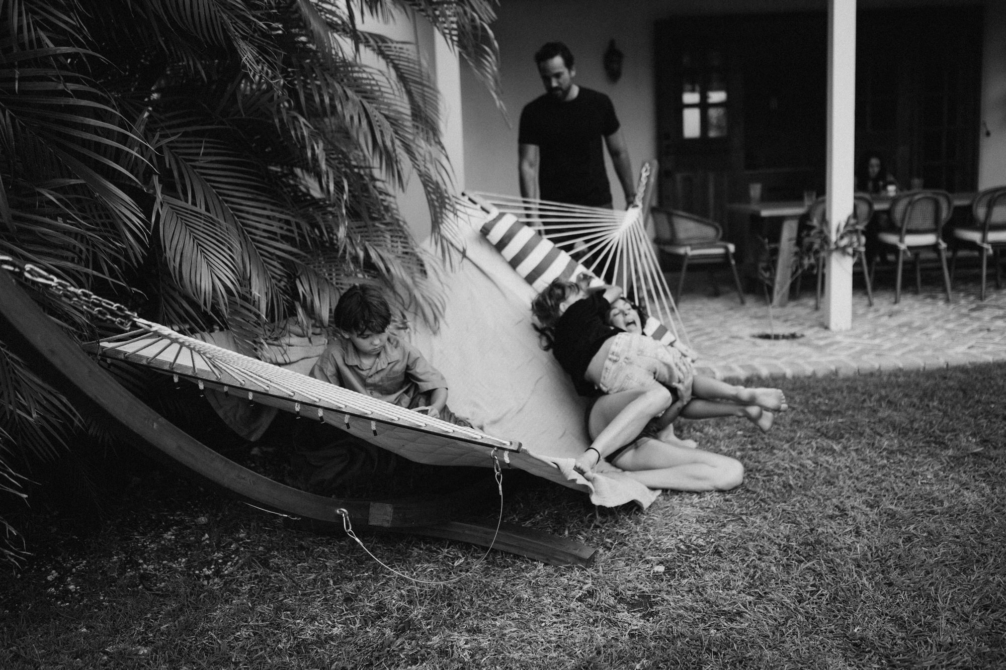 family playing in the hammock