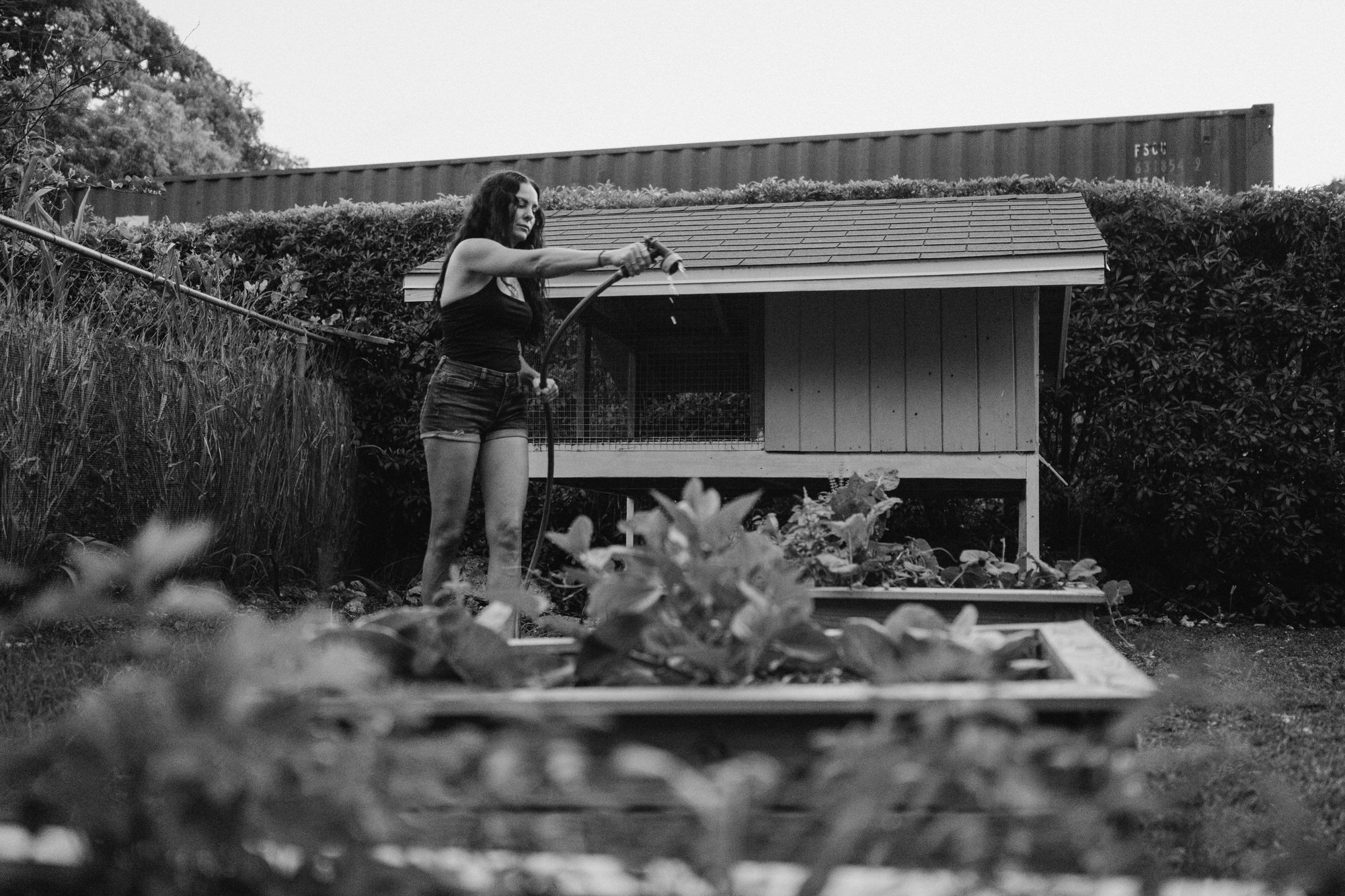 mom watering her garden