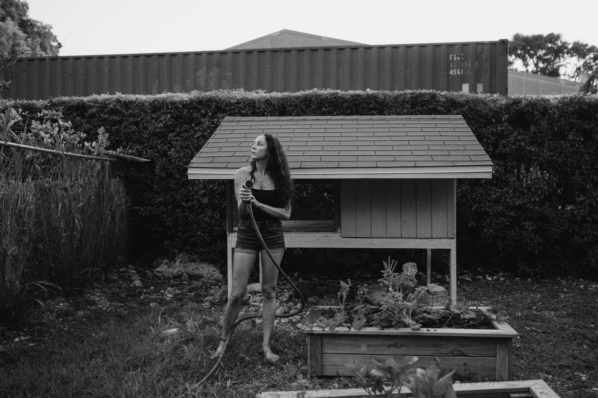 mom watering her garden