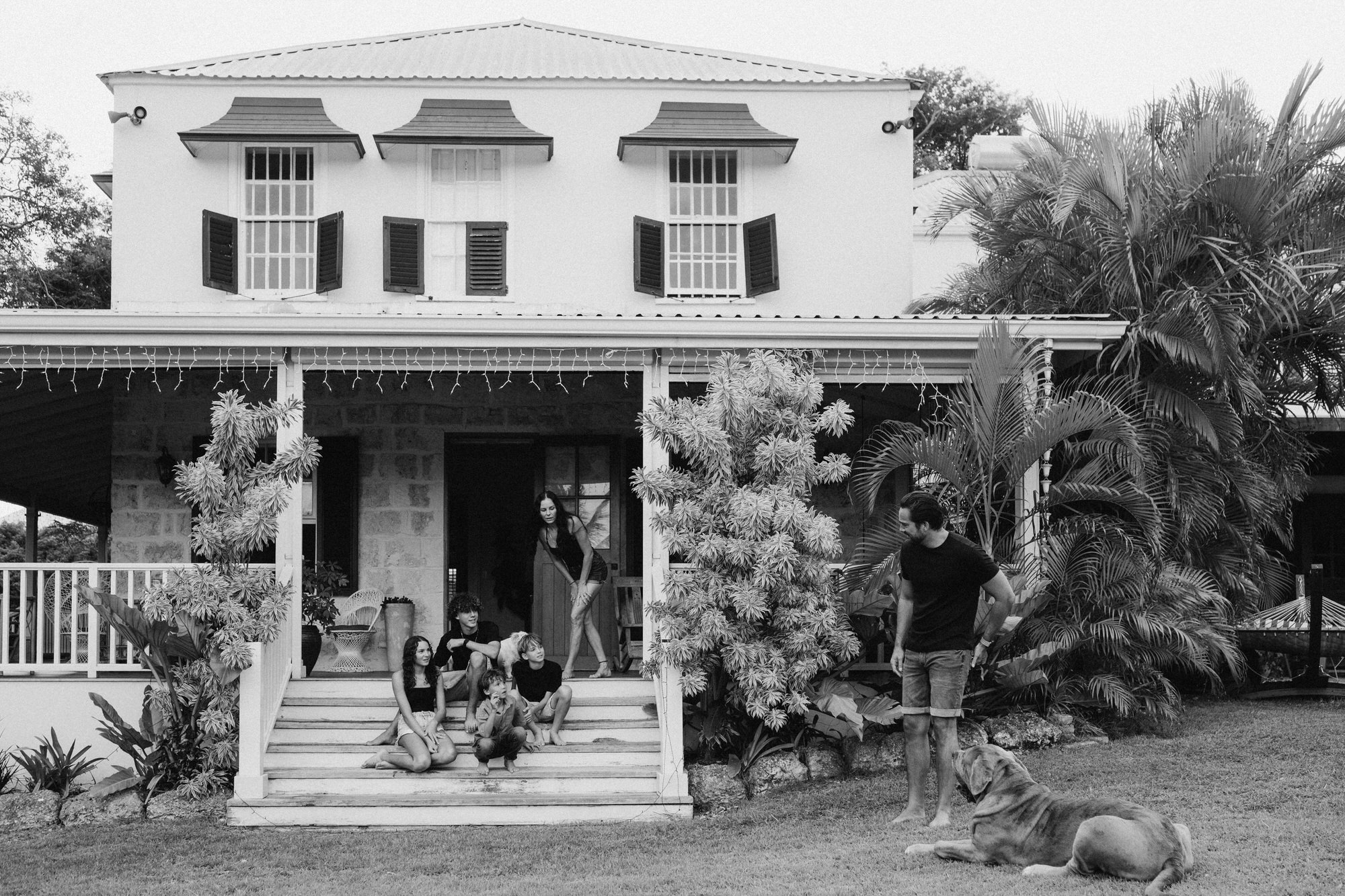 family of 6 with their dog on the wooden patio